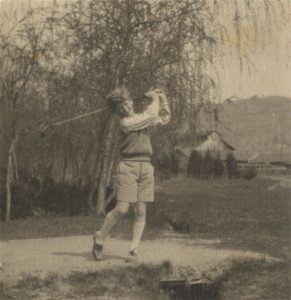 Playing golf, late 1920s